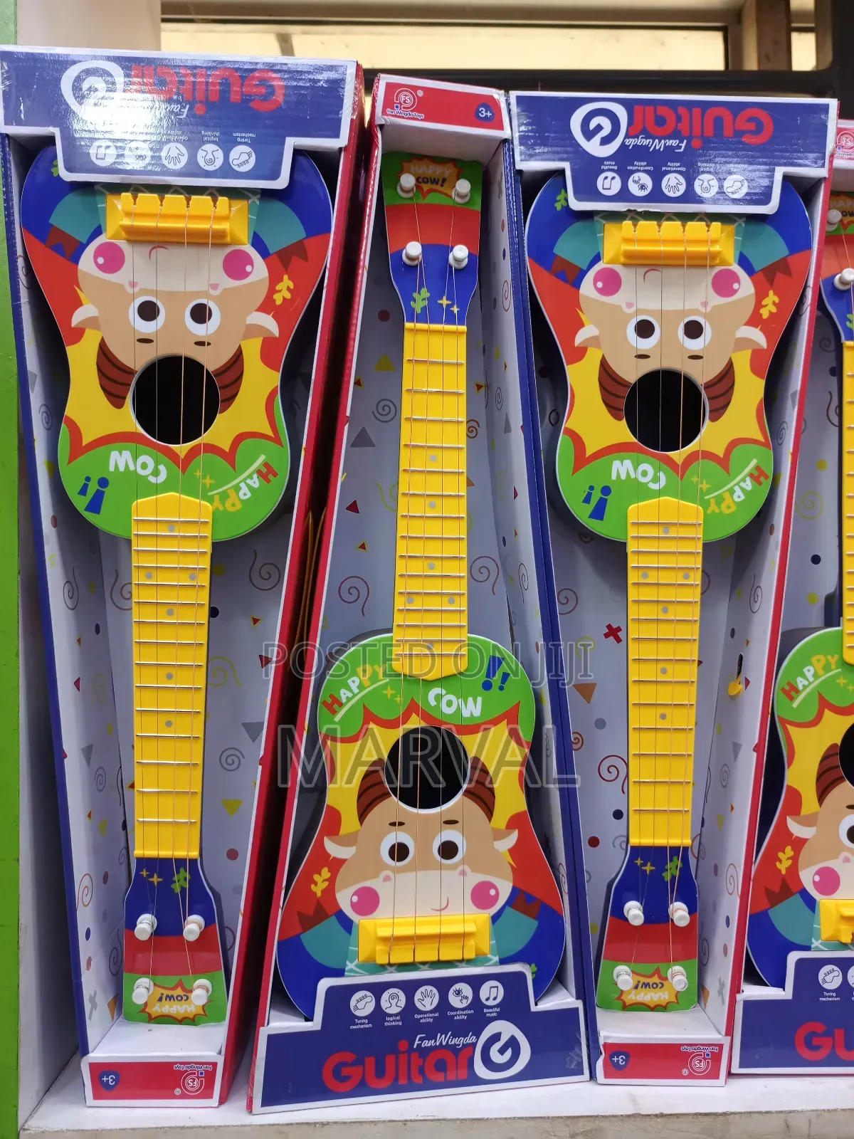 Fan Wingda Toy Guitars Designed for Children.