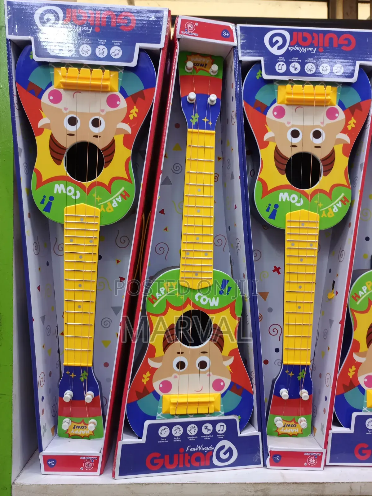 Fan Wingda Toy Guitars Designed for Children.