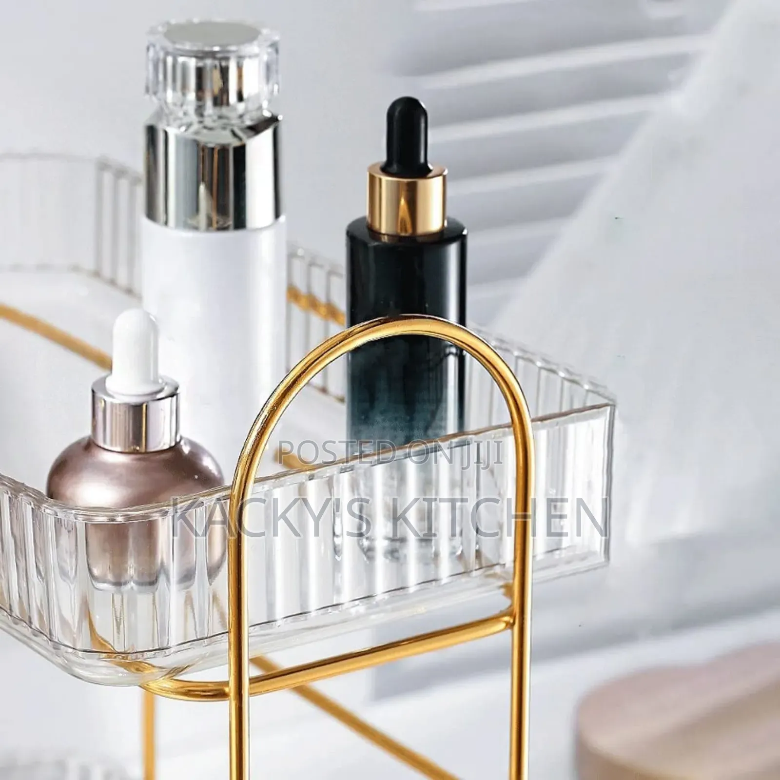Two-Tier Clear Acrylic and Gold-Toned Metal Makeup Organizer Rack.