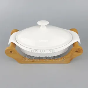 White Ceramic Casserole Dish With a Wooden Base
