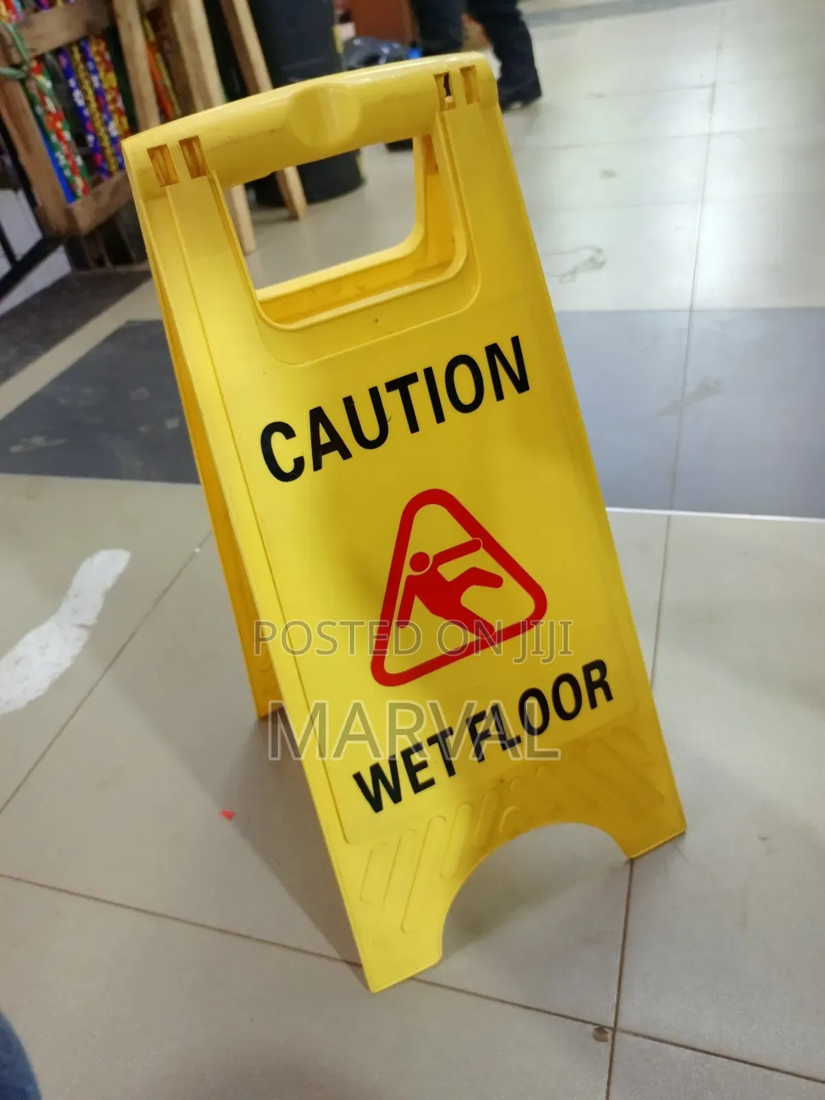 Frame "Caution Wet Floor" Sign.