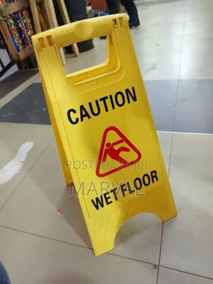 Frame "Caution Wet Floor" Sign.
