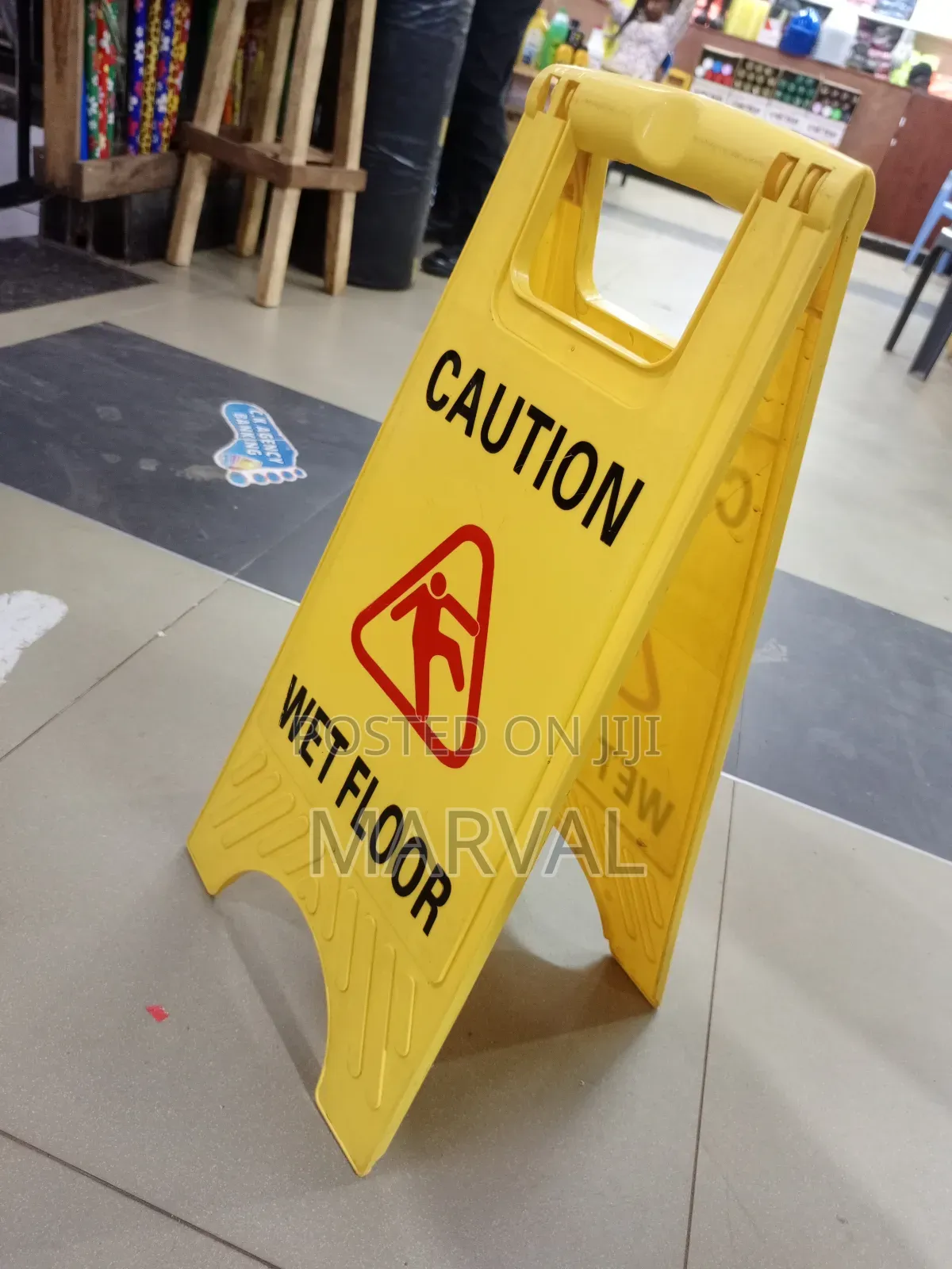 Frame "Caution Wet Floor" Sign.