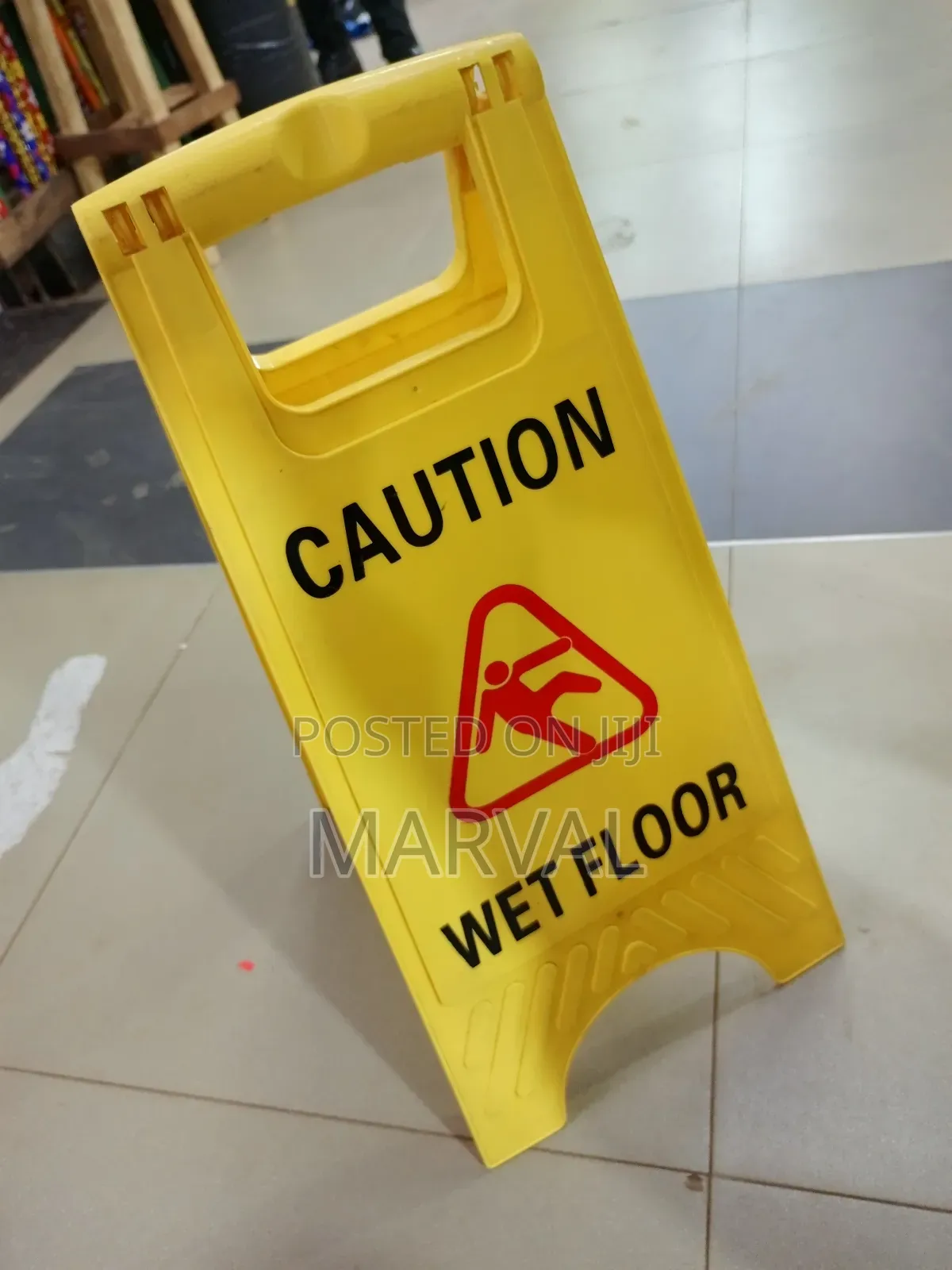 Frame "Caution Wet Floor" Sign.