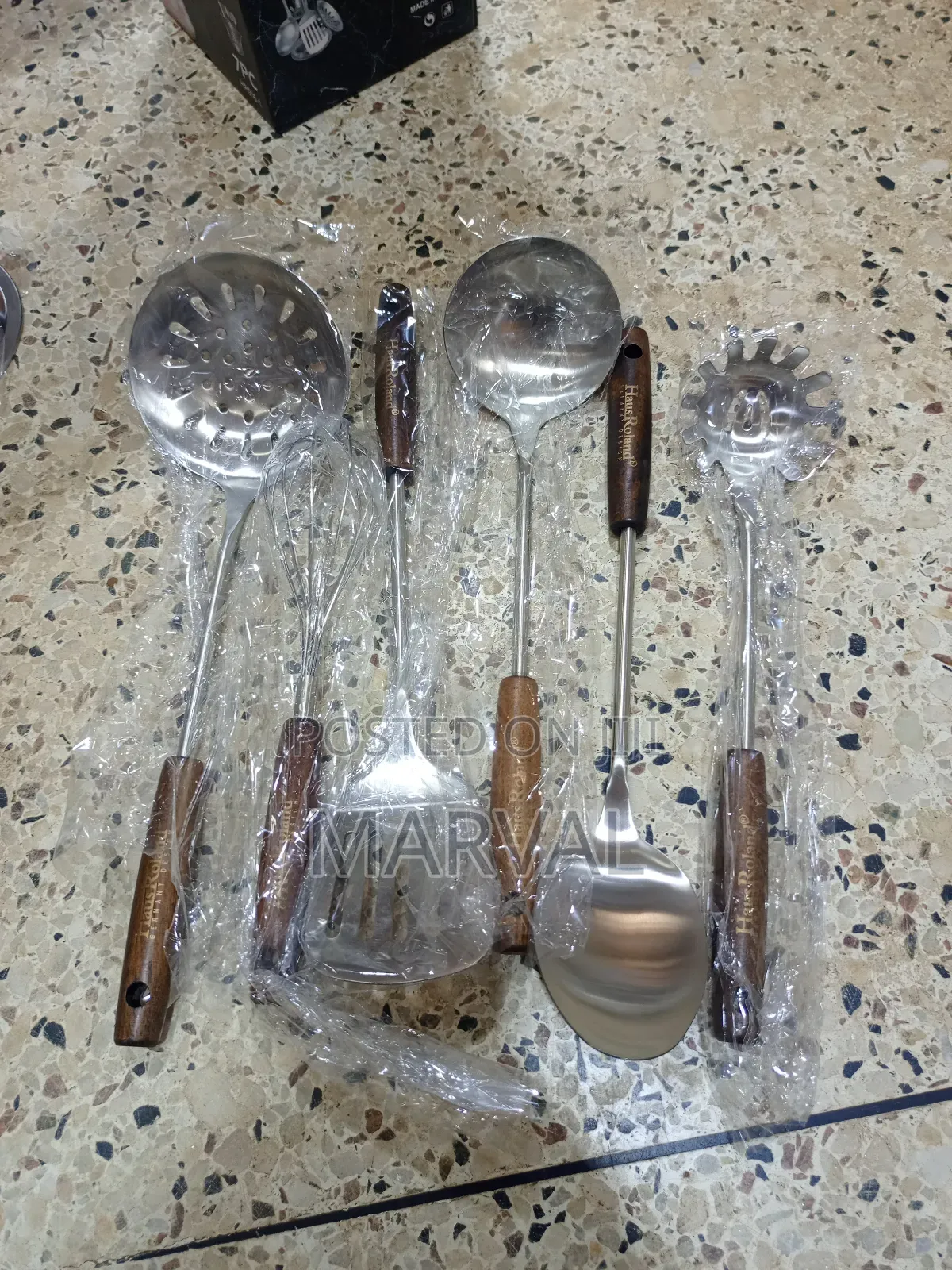 Durable Stainless Steel Kitchen Utensil Set With a Stand.