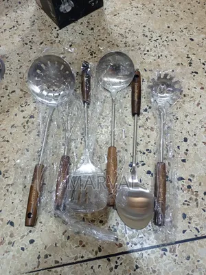 Durable Stainless Steel Kitchen Utensil Set With a Stand.