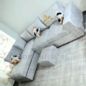 Off White Sofa With a Puff