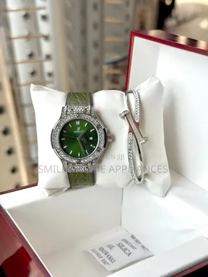 Green Leather Strapped Women's Hublot Analog Time Piece With Bracelet