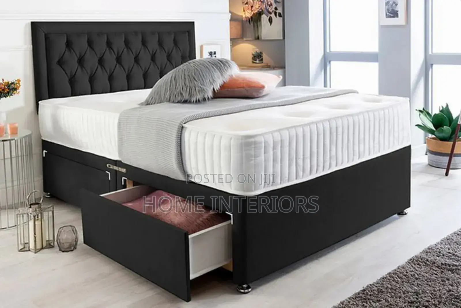 A Black Bed With a Storage Drawers