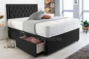 A Black Bed With a Storage Drawers