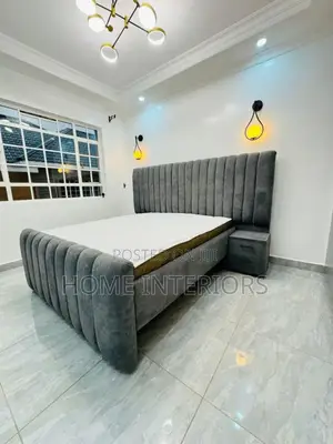 A Gray Bed With a Mattress