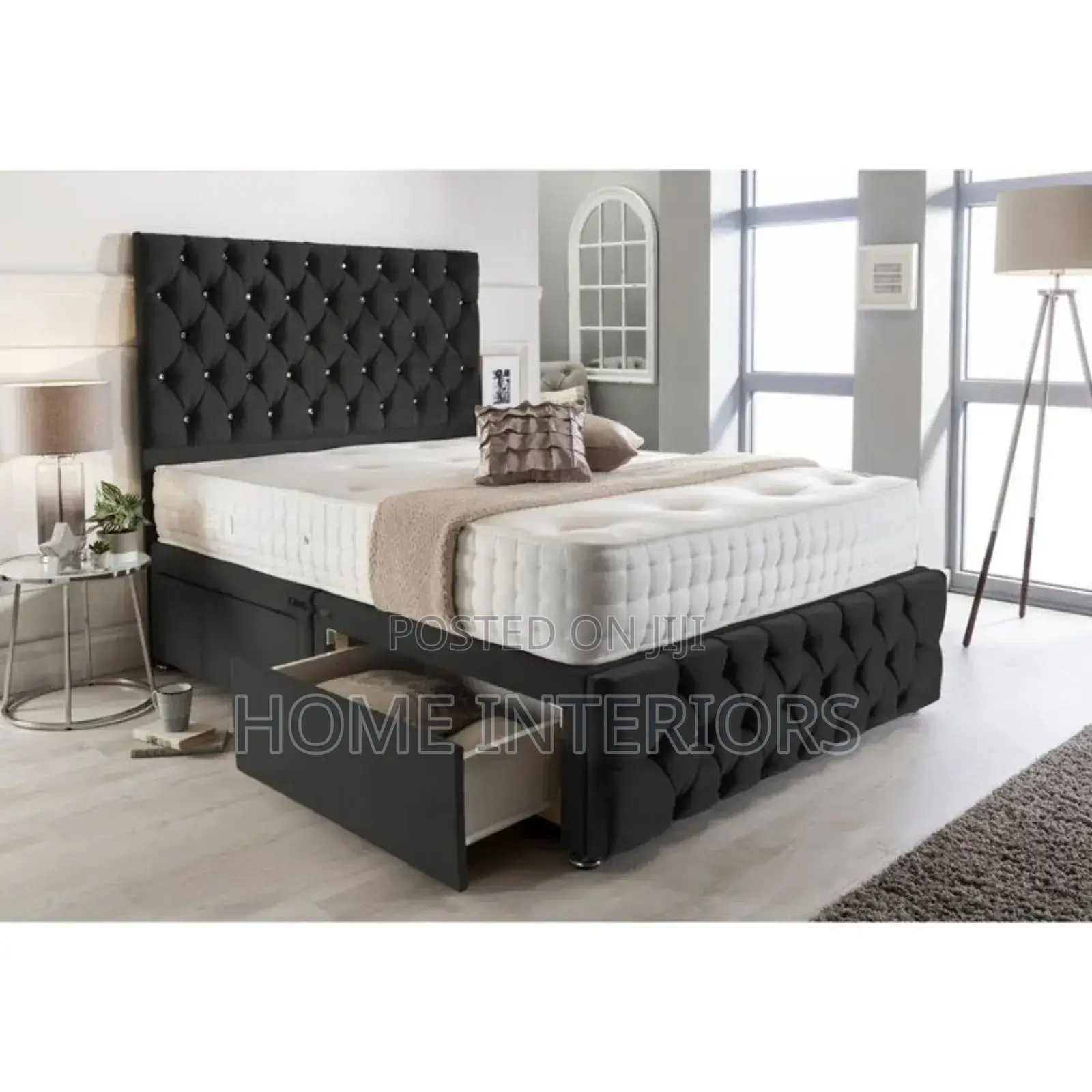 A Dark Gray  Bed With Two Storage Drawers