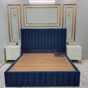 A Navy Blue Bed With White Storage Drawers