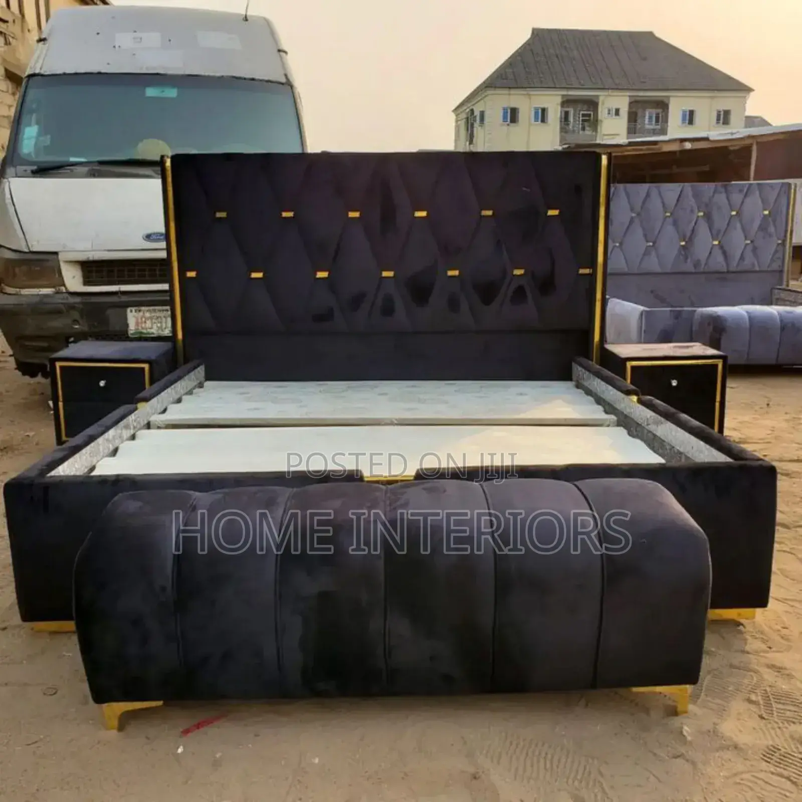 A Black Bed With Automan and Two Storage Drawers
