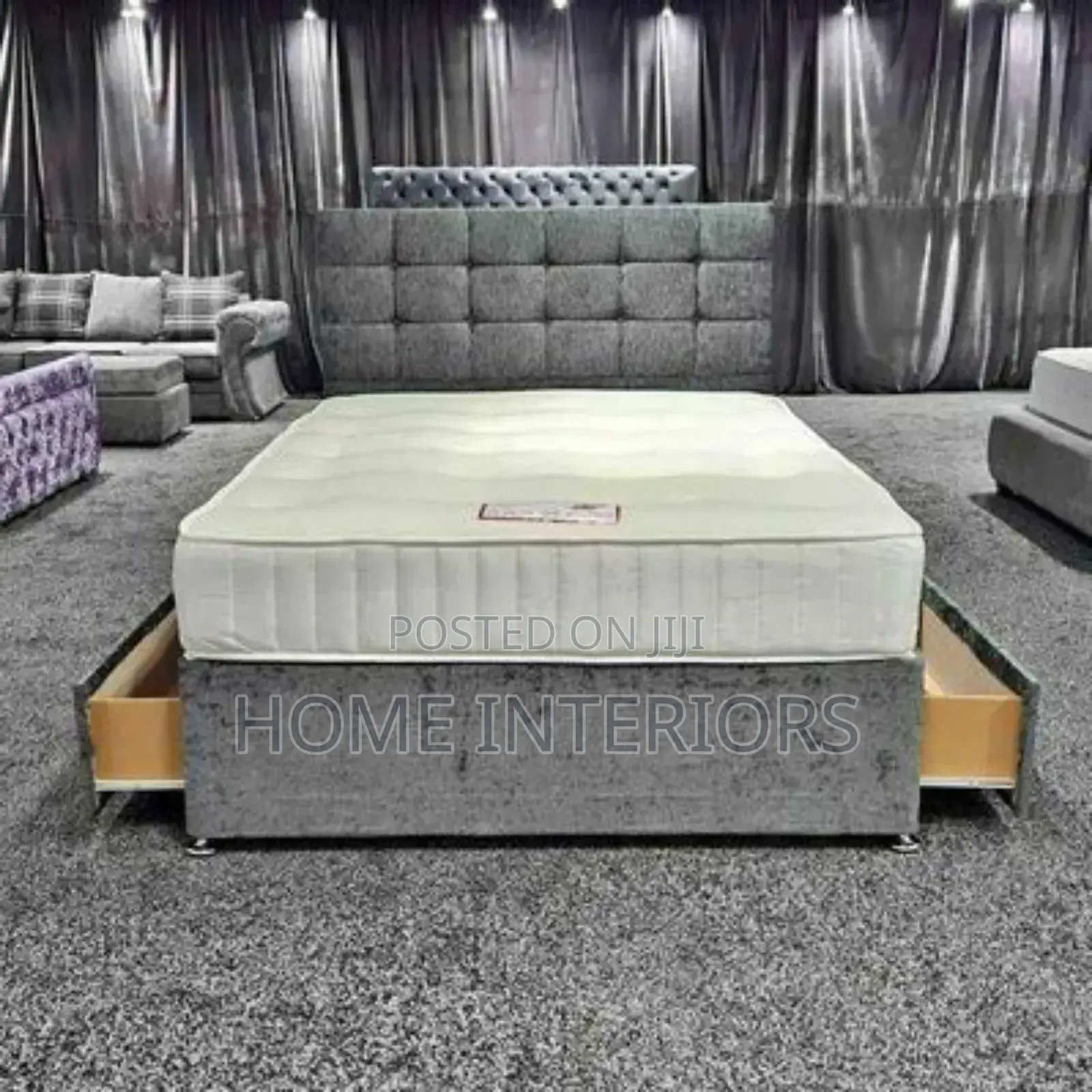 A Gray Bed With Storage Drawers