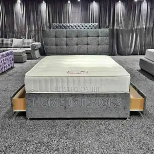 A Gray Bed With Storage Drawers