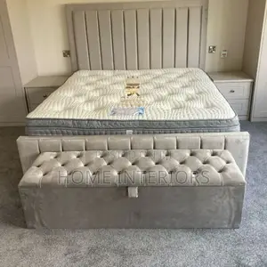 A Light Gray Colored Bed With Automan