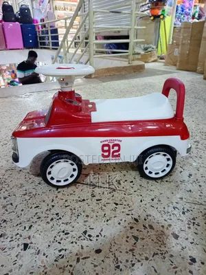 Red and White Ride-on Toy Car for a Child.