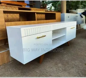 White Flat Tv Stand With a Shelf in the Middle