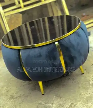 Round Dressed Centre Table With a Glass on Top and Golden Legs