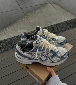 Asics Gel-1130 Sneakers in the "White/Cloud Grey" Colorway.