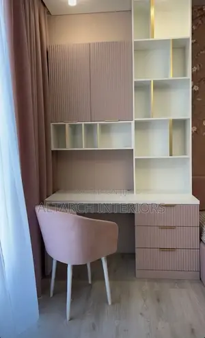 Well Furnished Reading Table in White and Pink With a Dressed Chair