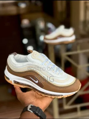 Nike Air Max 97 Premium "Muslin Pink Foam" Sneaker.