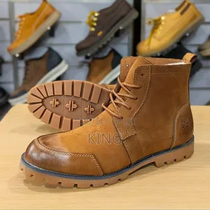 Brown Timberland Boots With a Lace-Up Closure.