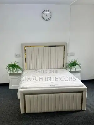 White Dressed Leather Bed With Gold Strips and Bedside Drawers