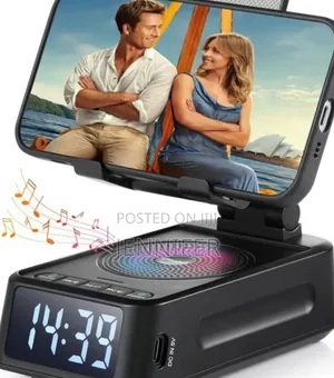 Phone Stand With Wireless Speaker and Alarm Clock.