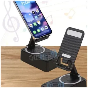 Phone Stand With Wireless Speaker And Alarm Clock.