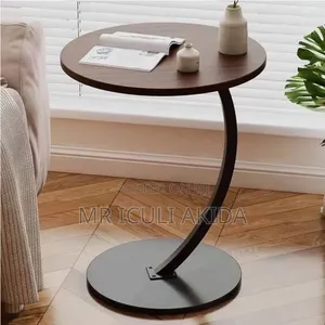 C-Shaped End Table With a Round Wooden Top and a Black Metal Base