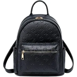 A Black Faux Leather Backpack With a Monogram Pattern