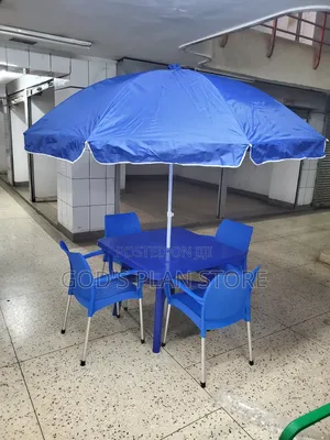 Blue Umbrella and Plastic Chairs and Blue Plastic Table
