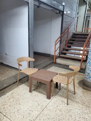 Ratten Coffee Table and Plastic Chairs