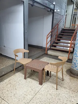 Ratten Coffee Table and Plastic Chairs