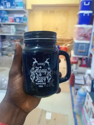 Black Glass Mason Jar Mug With a Handle and a Lid.