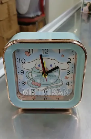 Alarm Clock With a Light Blue and Rose Gold Frame