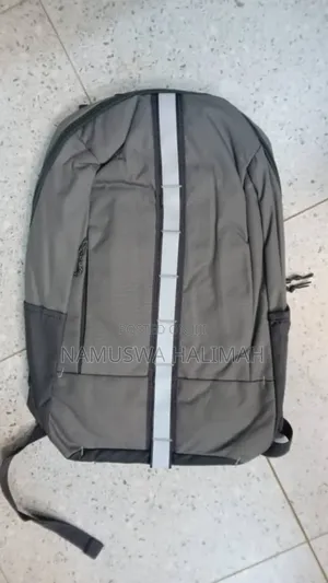 Gray Laptop Backpack With a Reflective Stripe.