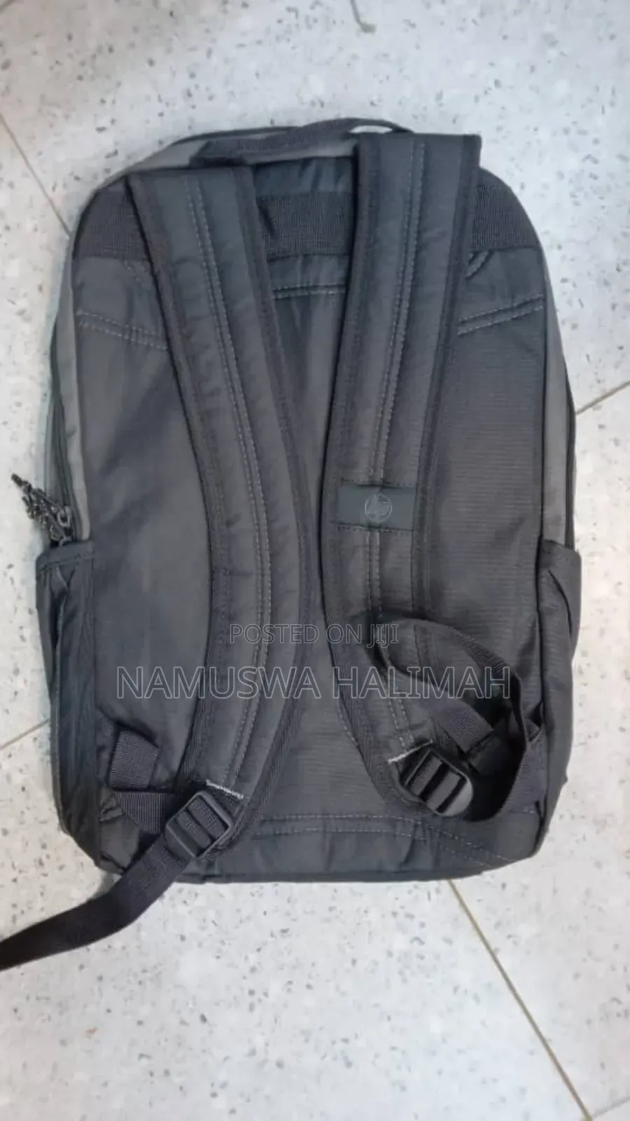 Gray Laptop Backpack With a Reflective Stripe.