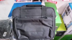 Black Carrying Case, Likely for a Laptop or a Projector.