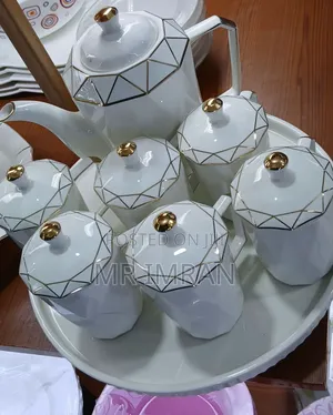 White Ceramic Tea Set With a Geometric Gold Trim
