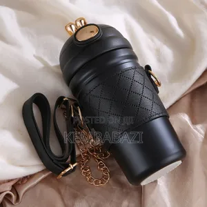 Stainless Steel Thermos Bottle With a Leather Sleeve.