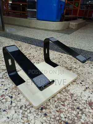 Portable Laptop Stand With a Wooden Base and Black Metal Frame.