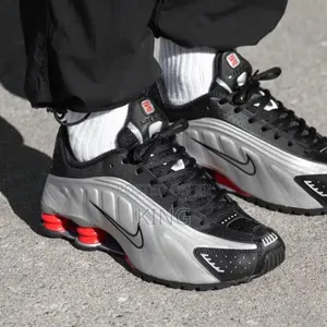 Nike Shox R4 'Black and Metallic Silver' Sneaker.