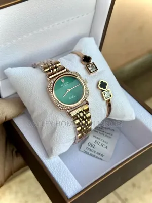 Rose Gold Women's Analog Wrist Time Piece With Its Bracelet