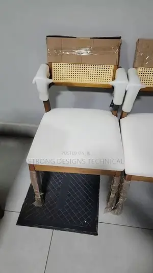 A Pair Of 2 Rattan Dining Chair