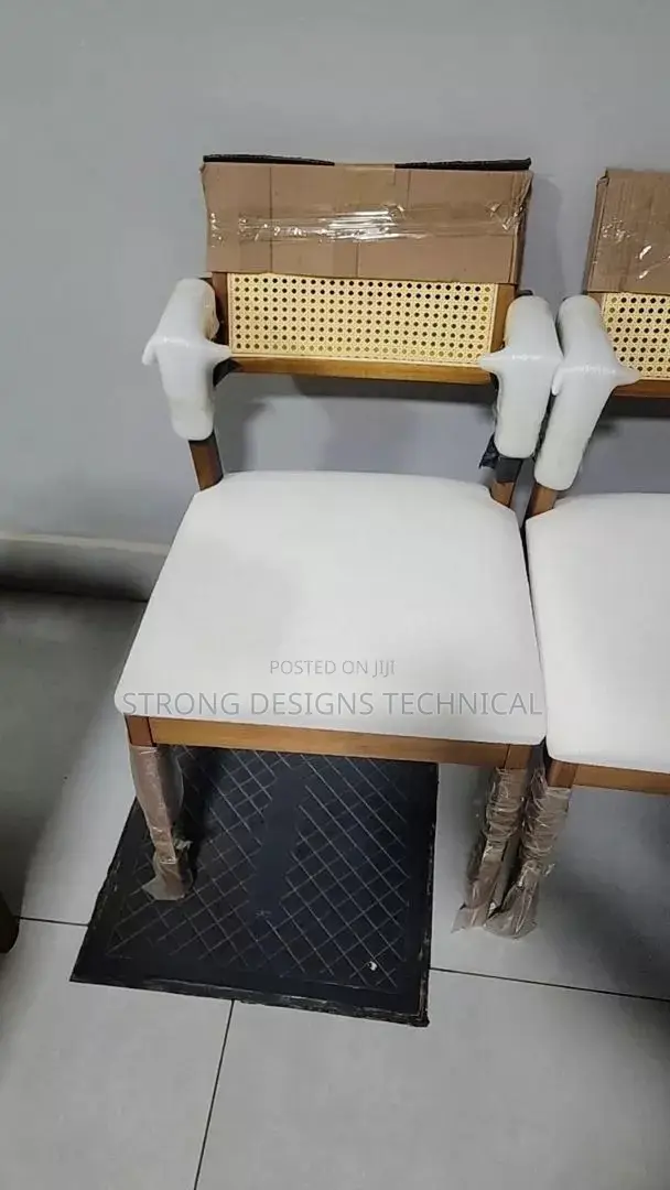 A Pair Of 2 Rattan Dining Chair