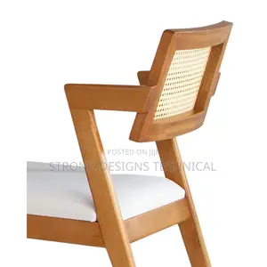 A Pair Of 2 Rattan Dining Chair