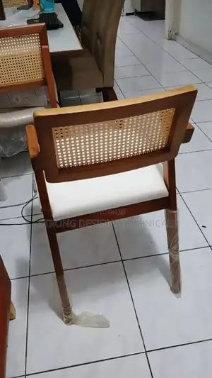 A Pair Of 2 Rattan Dining Chair